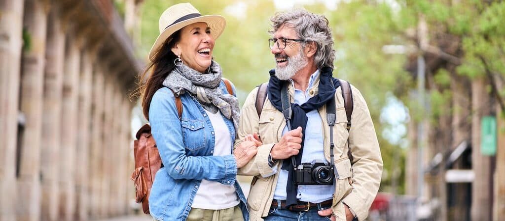 Couple walking and laughing outdoors